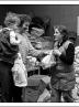 Postcard of distributing food packages to striking miners and their families at Maerdy Miners’ Institute in February 1985.