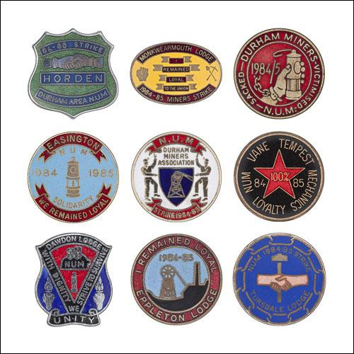 Greetings card of a collection of enamel badges from the Durham area.