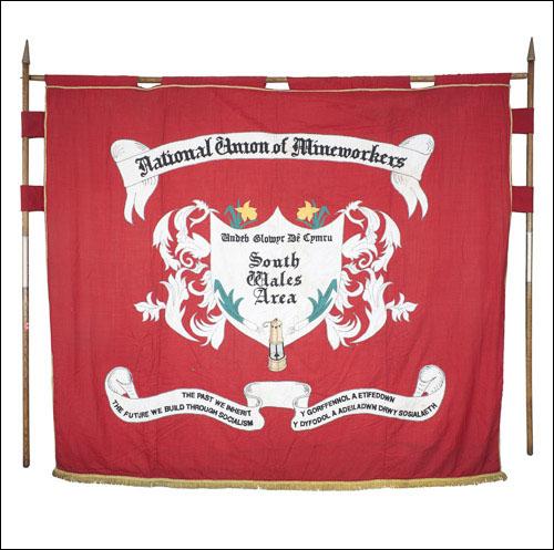 Greetings card of the front of the banner of the South wales Area of the NUM.