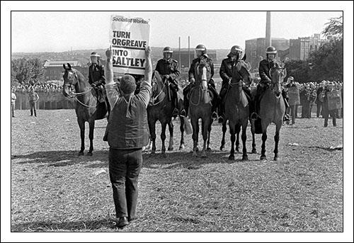 Postcard of a picket holding placard reading "Turn Orgreave into Saltley" on 18th June 1984.