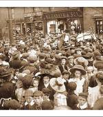 Mary Mcarthur addressing a crowd in a street during the strike
